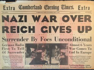 Headline "Nazi War Over, Reich Gives Up" from the Cumberland Evening Times, 05/07/1945