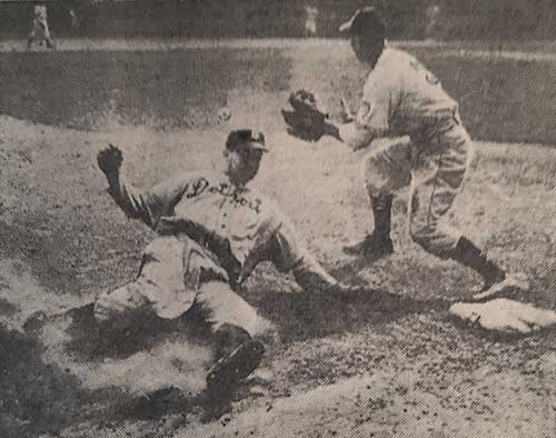 Rudy York of the Detroit Tigers sliding into third base, May 8, 1945