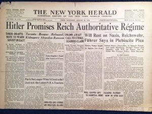 Headline "Hitler Promises Reich Authoritative Regime" from the New York Herald, 08/18/1934